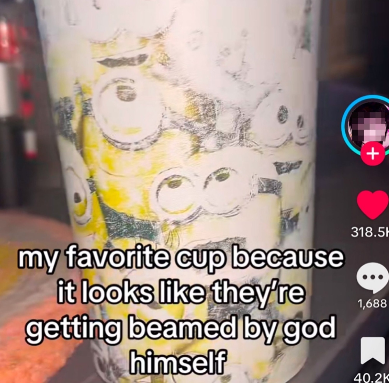 A cup printed with panicking Minions faces, captioned 'getting beamed by god himself'