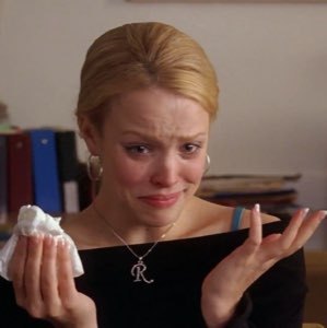 Blonde woman crying and holding a tissue with a baffled, ugly-cry face