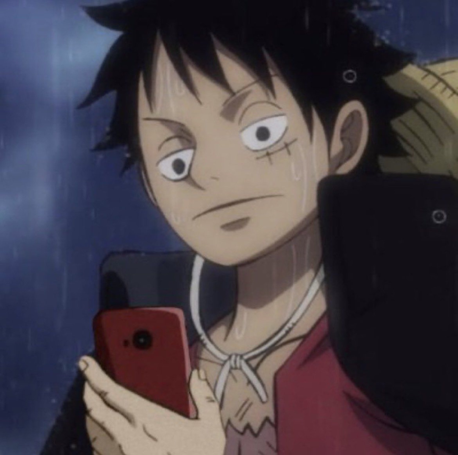 Luffy from One Piece clutching a phone in the rain with a wary side-eye