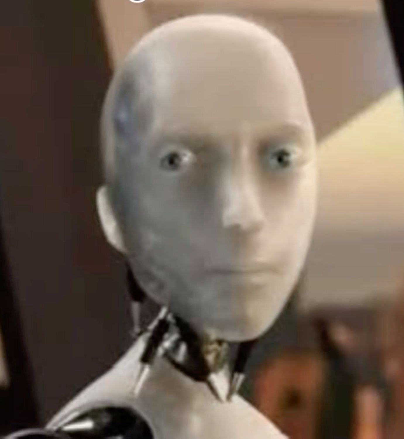 Wide-eyed humanoid robot staring blankly ahead in mild disbelief