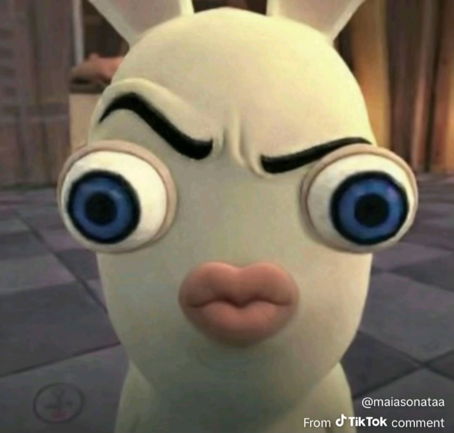 Raving Rabbid with one raised eyebrow and pursed kissy lips