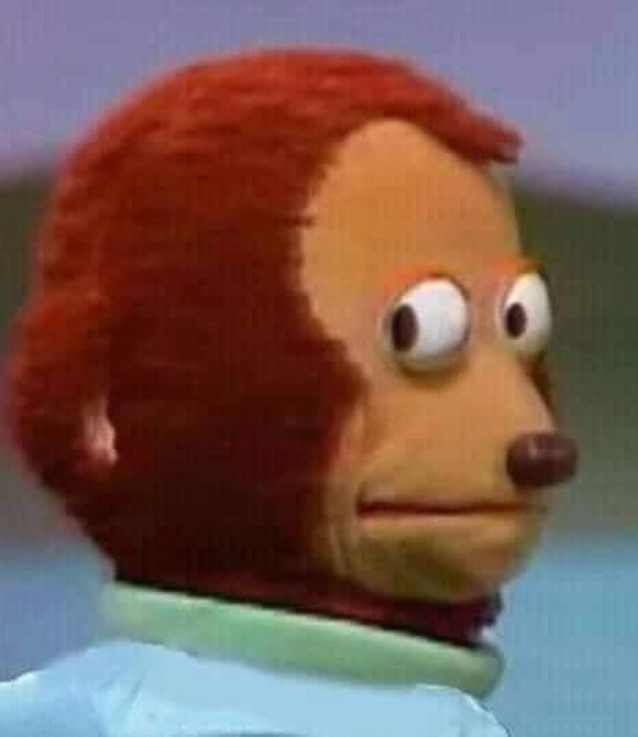 The monkey puppet glancing awkwardly to the side