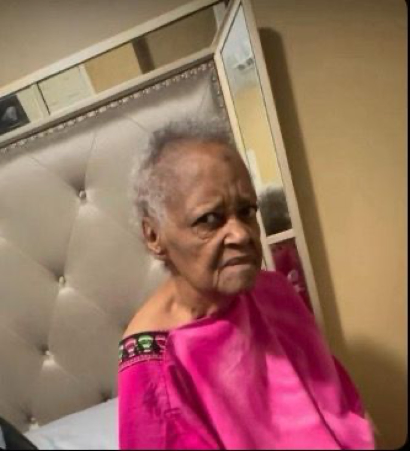 Elderly woman turning to shoot a deeply skeptical, judgmental side-glance