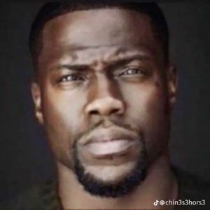 Kevin Hart staring straight ahead with intense narrowed eyes and a stone-cold expression
