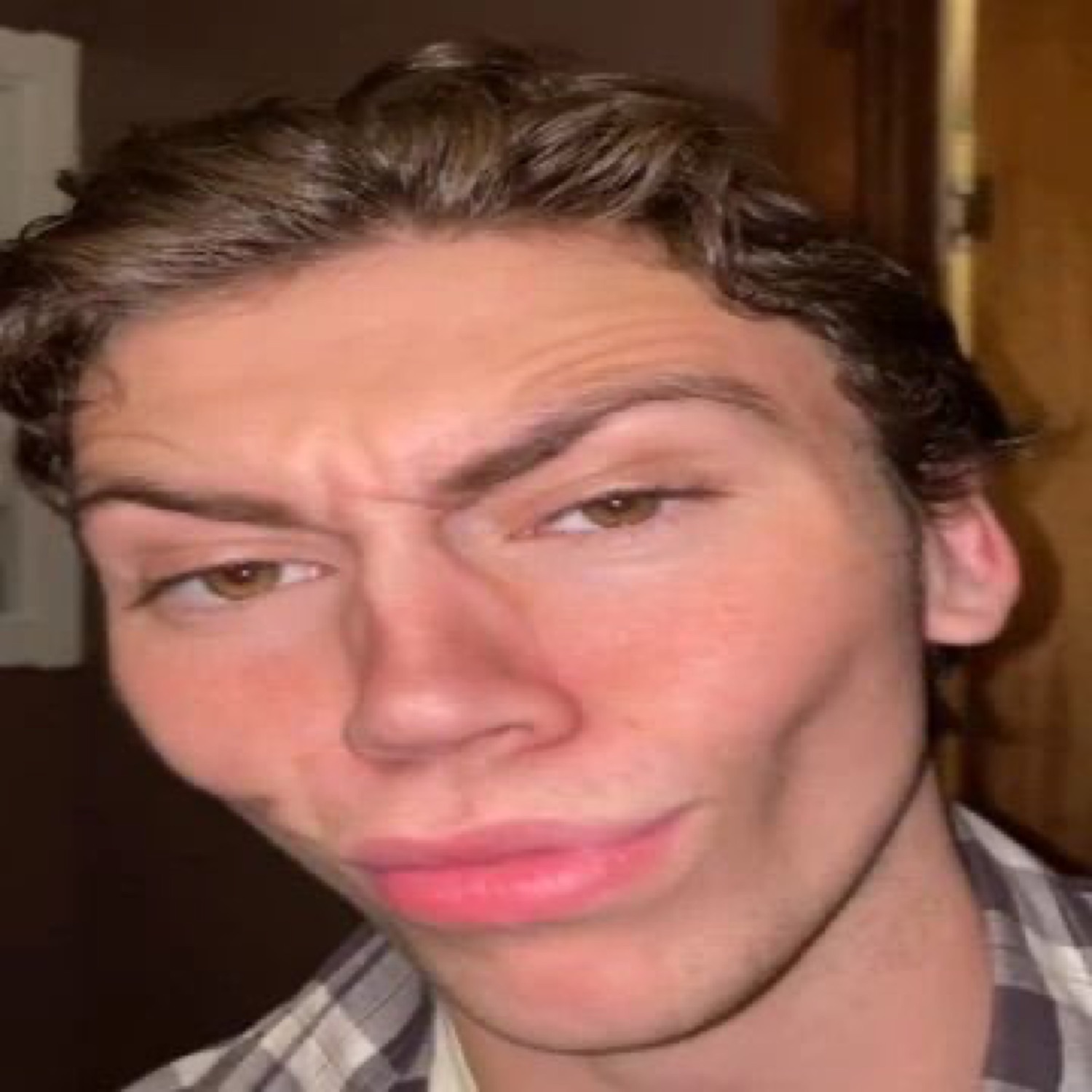 Guy doing the smug sigma face: raised eyebrow, pursed lips