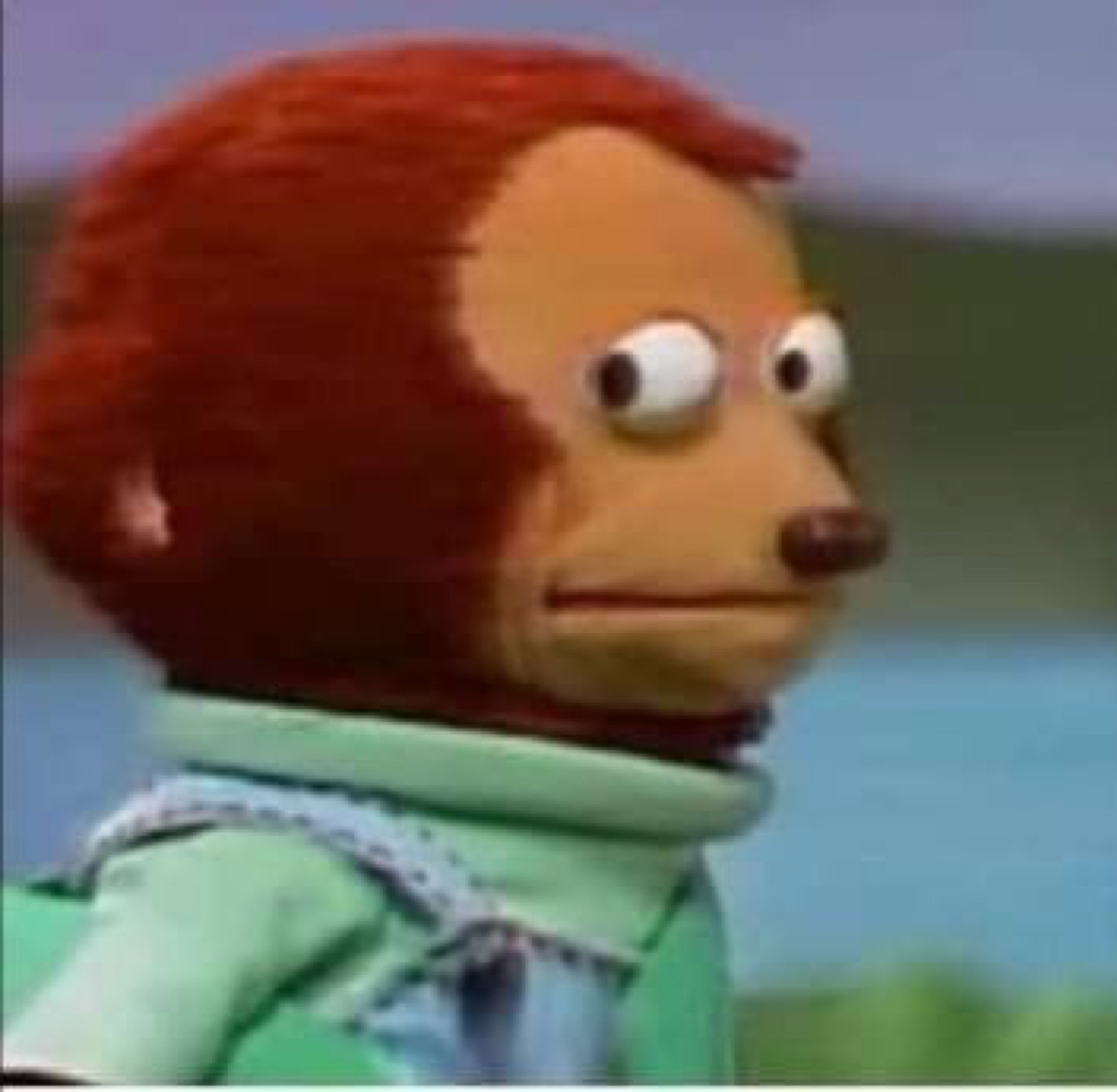 Puppet monkey looking away awkwardly to the side, pretending not to notice