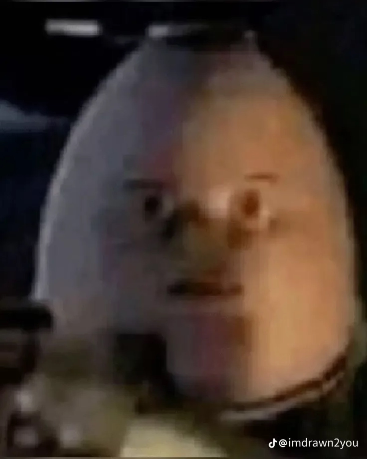 Person in a white ski mask staring blankly at the camera with a blank, unnerving expression