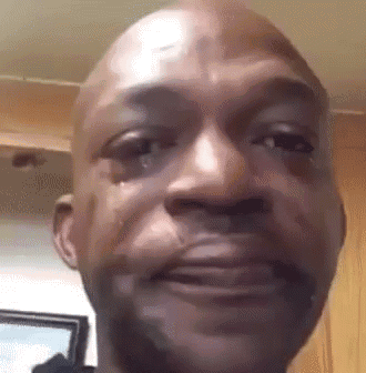 Man filming himself from below as a single tear rolls down his cheek