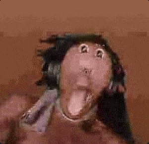 Grainy distorted monkey-like face screaming with mouth wide open