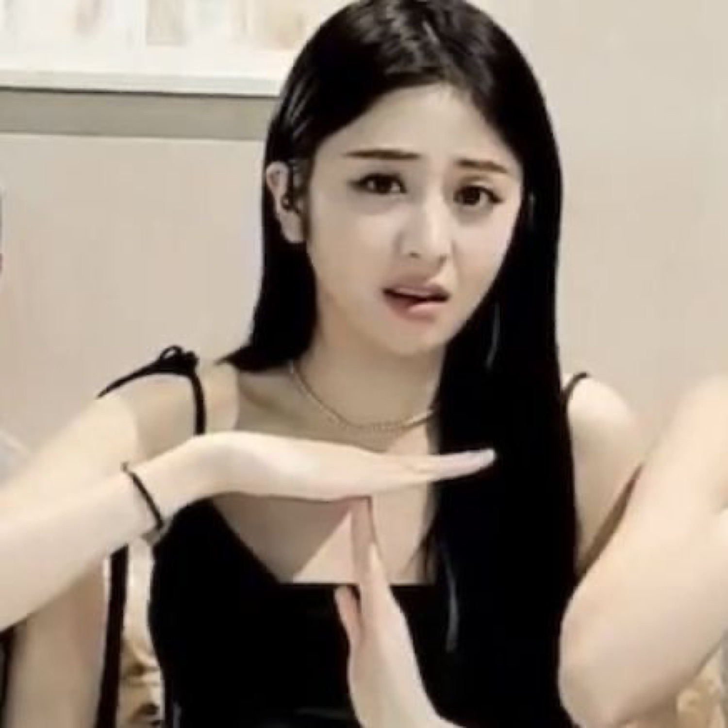 Young woman making a T timeout gesture with a worried, confused expression