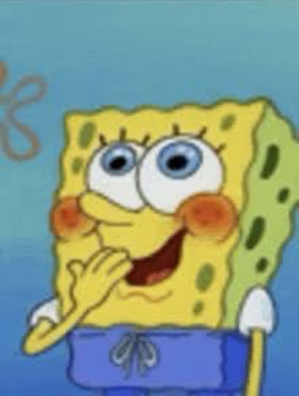 SpongeBob with rosy cheeks resting his chin on his hand looking giddy and smitten