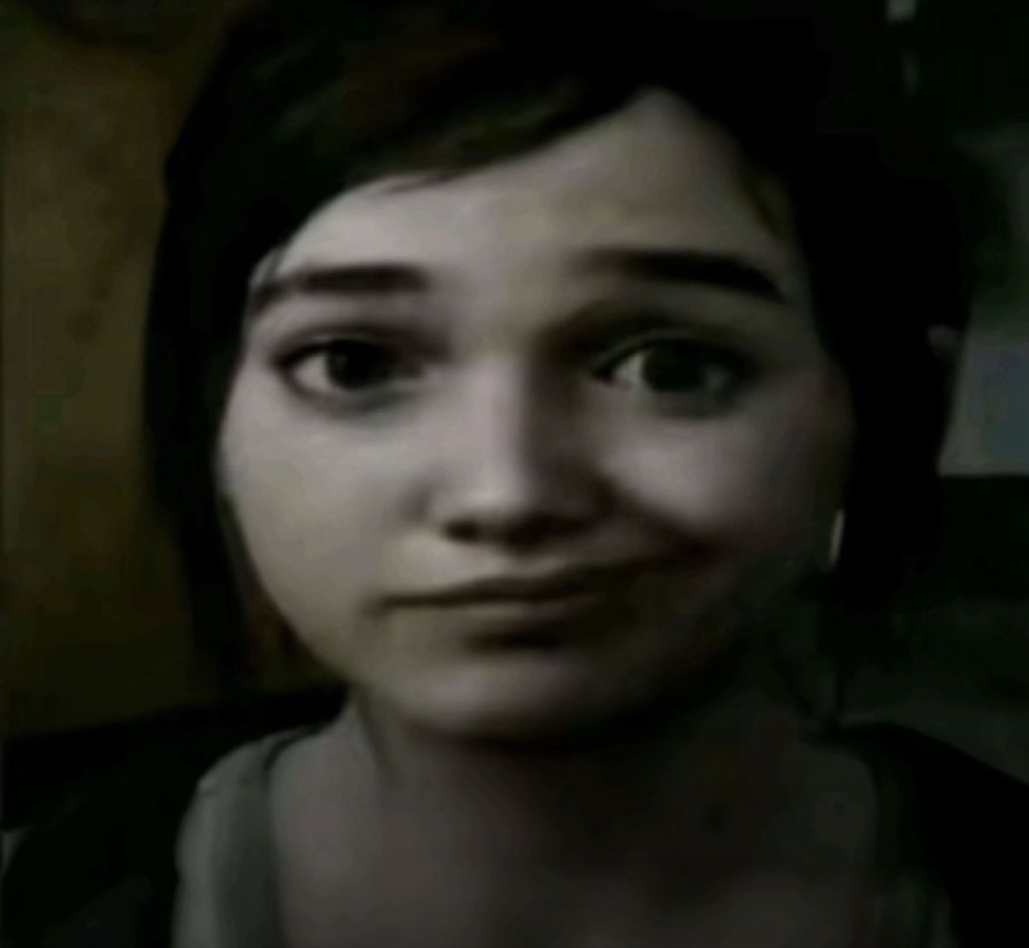 Girl with a subtle sly smirk staring straight at the camera