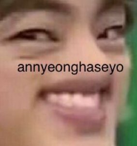 Extreme close-up of a wide cheesy grin captioned 'annyeonghaseyo'