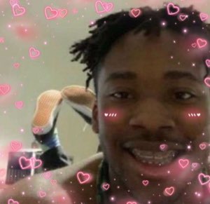 Guy with braces beaming through a pink hearts-and-blush filter