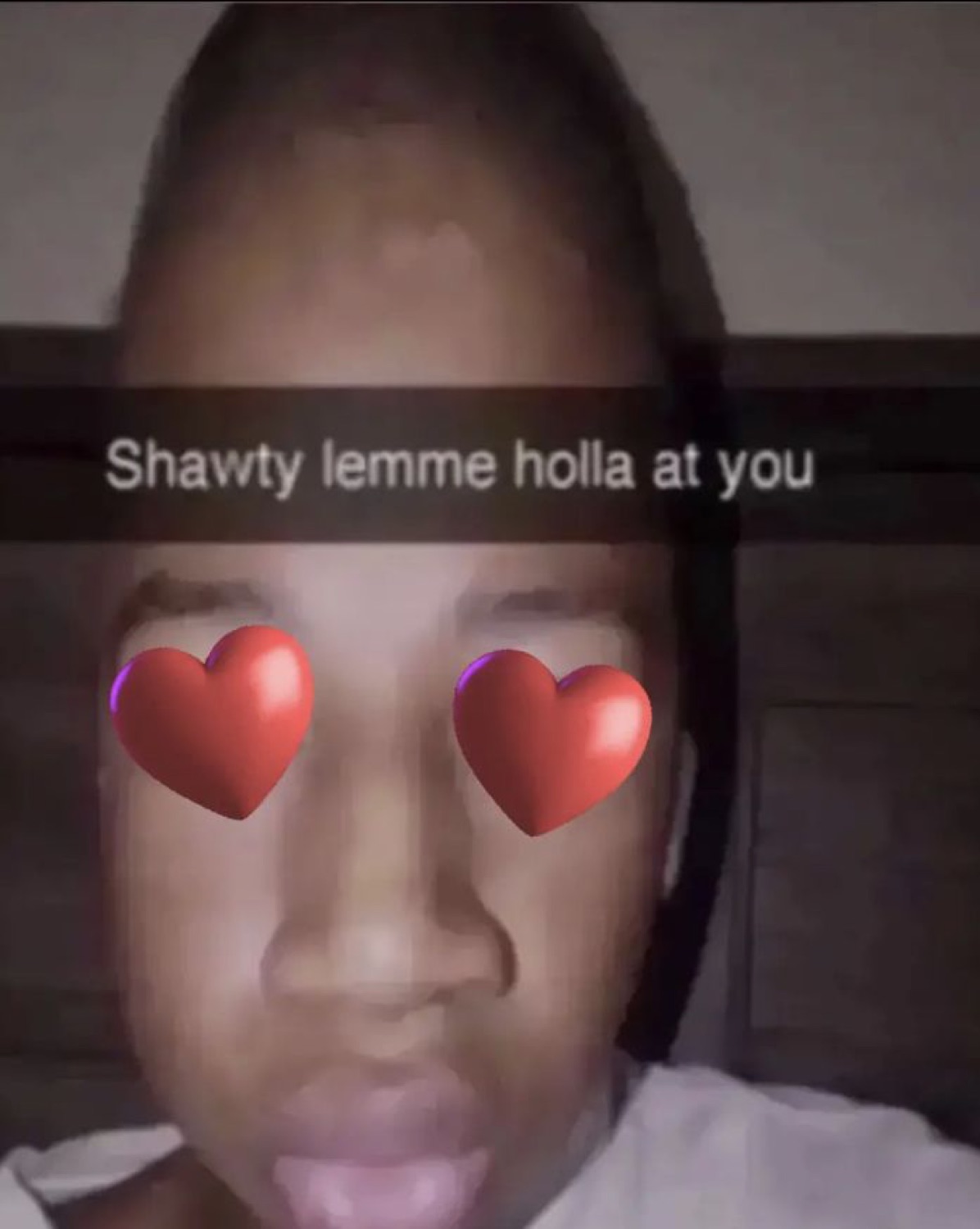 Person with heart-eyes filter and tongue out on Snapchat captioned 'Shawty lemme holla at you'