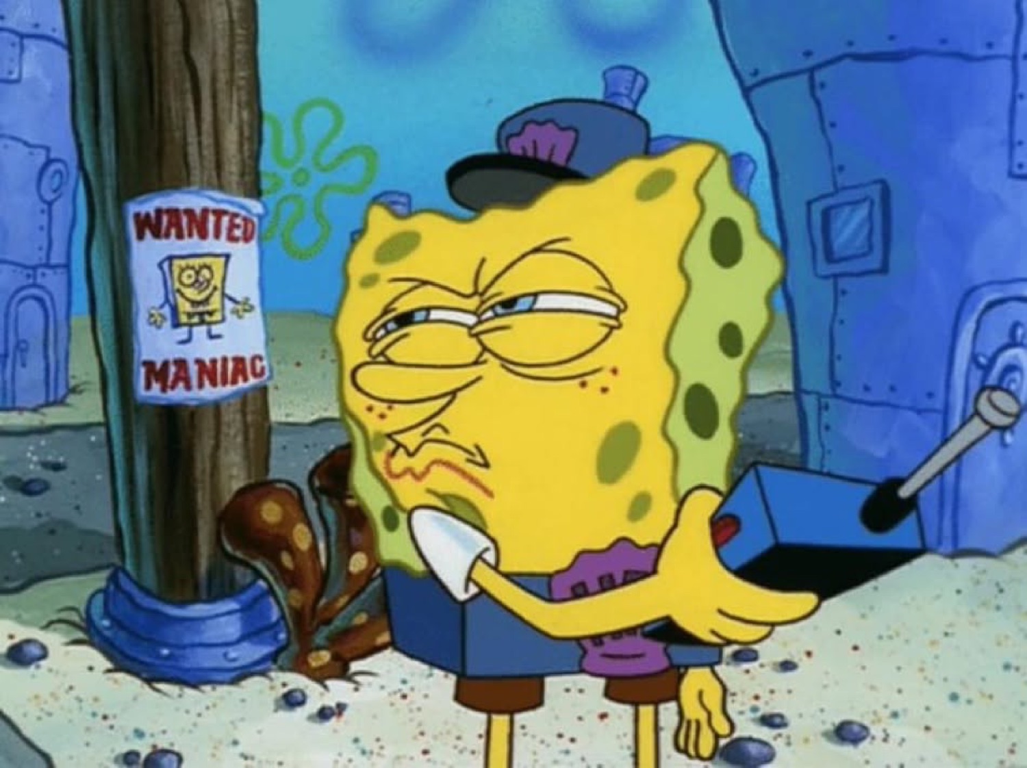 SpongeBob in a police hat with a smug half-lidded look beside a 'WANTED MANIAC' poster