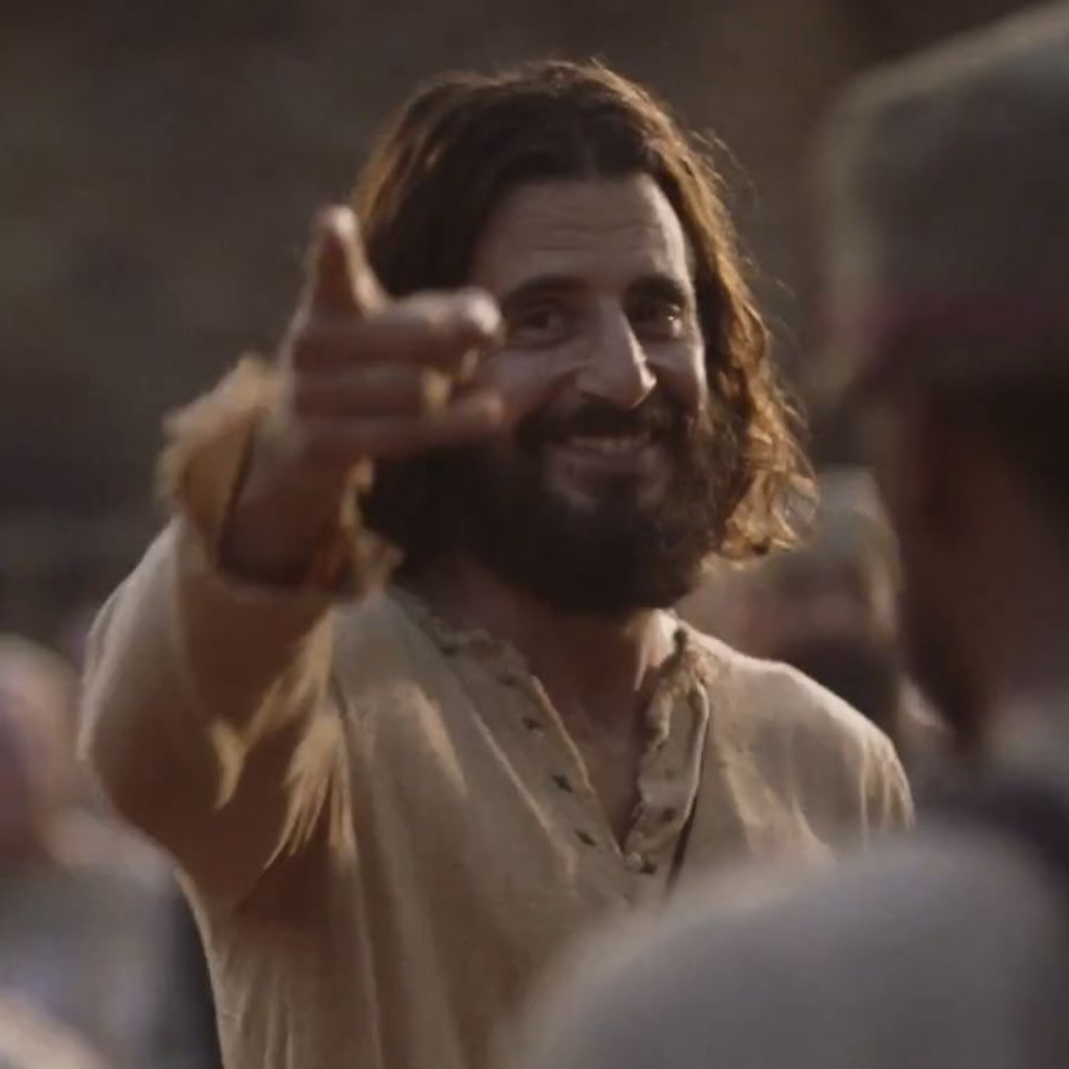 Jesus smiling and pointing at the camera