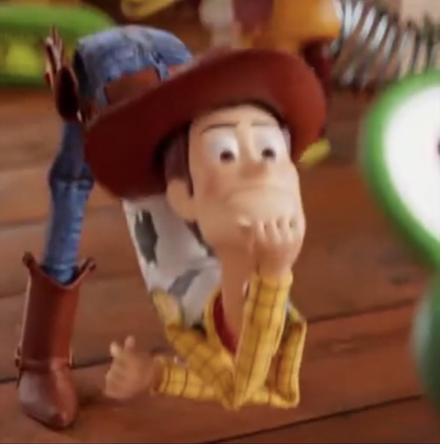 Woody from Toy Story crouching low with a hand over his mouth in wide-eyed disbelief