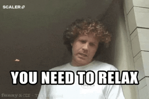 Curly-haired man calmly saying "You need to relax"
