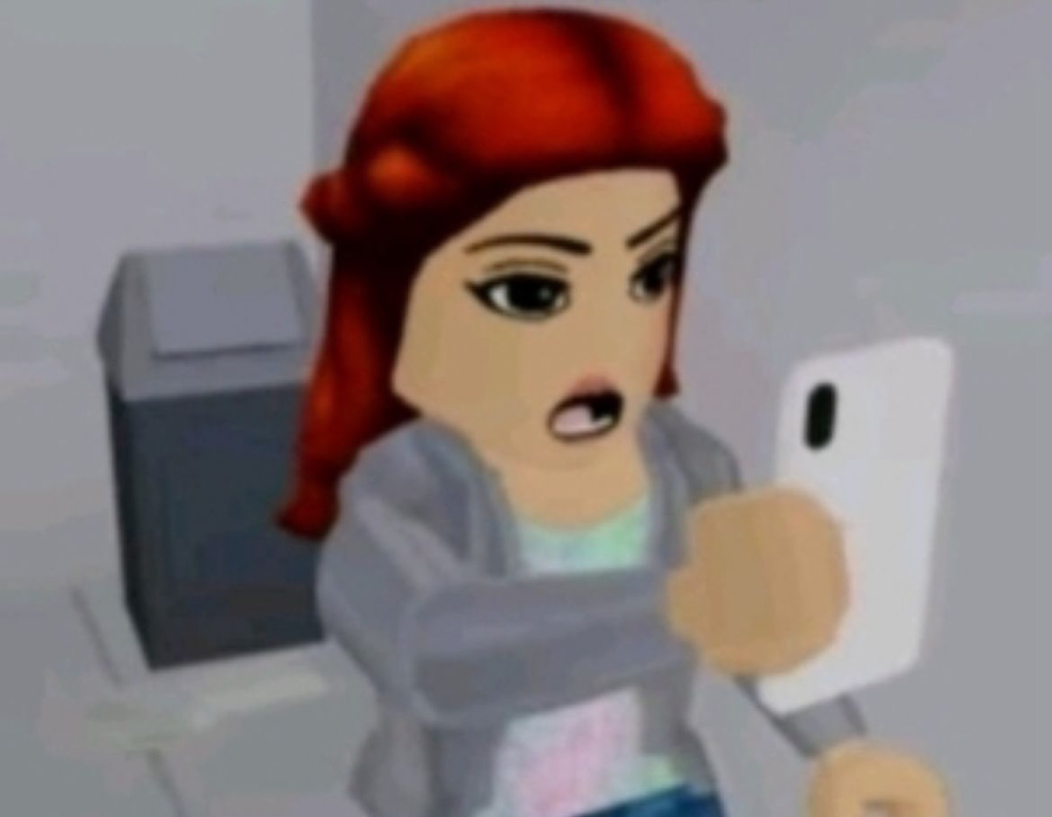 Red-haired Roblox avatar gasping in outrage while clutching her phone