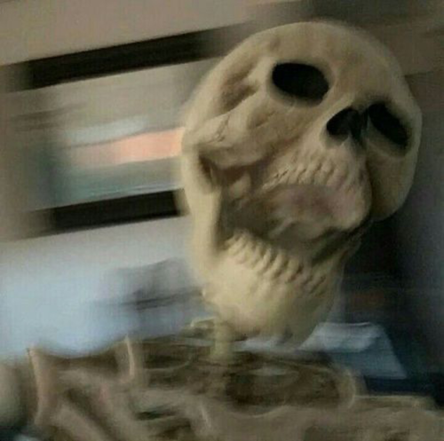 Motion-blurred skeleton lunging at the camera