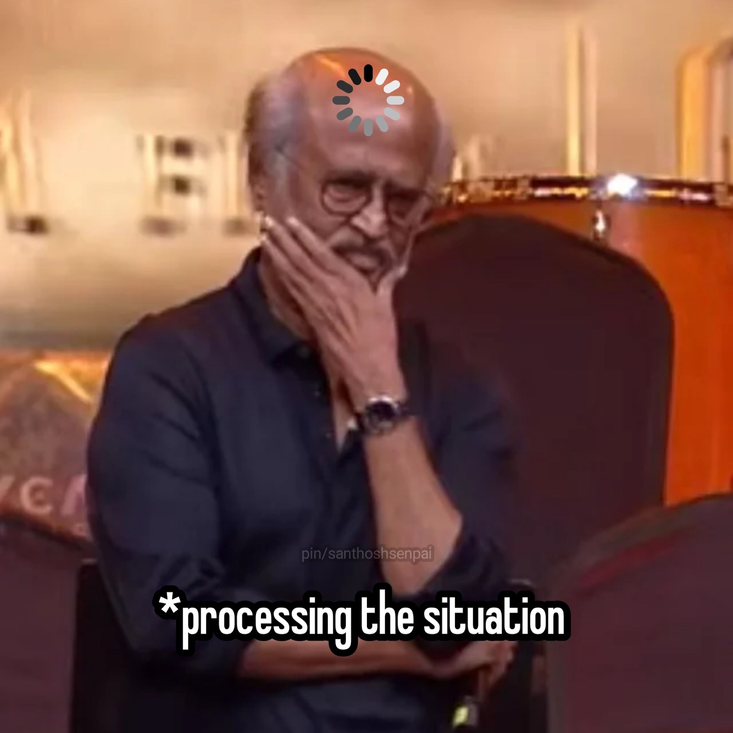 Rajinikanth covering his mouth with a loading spinner: '*processing the situation'