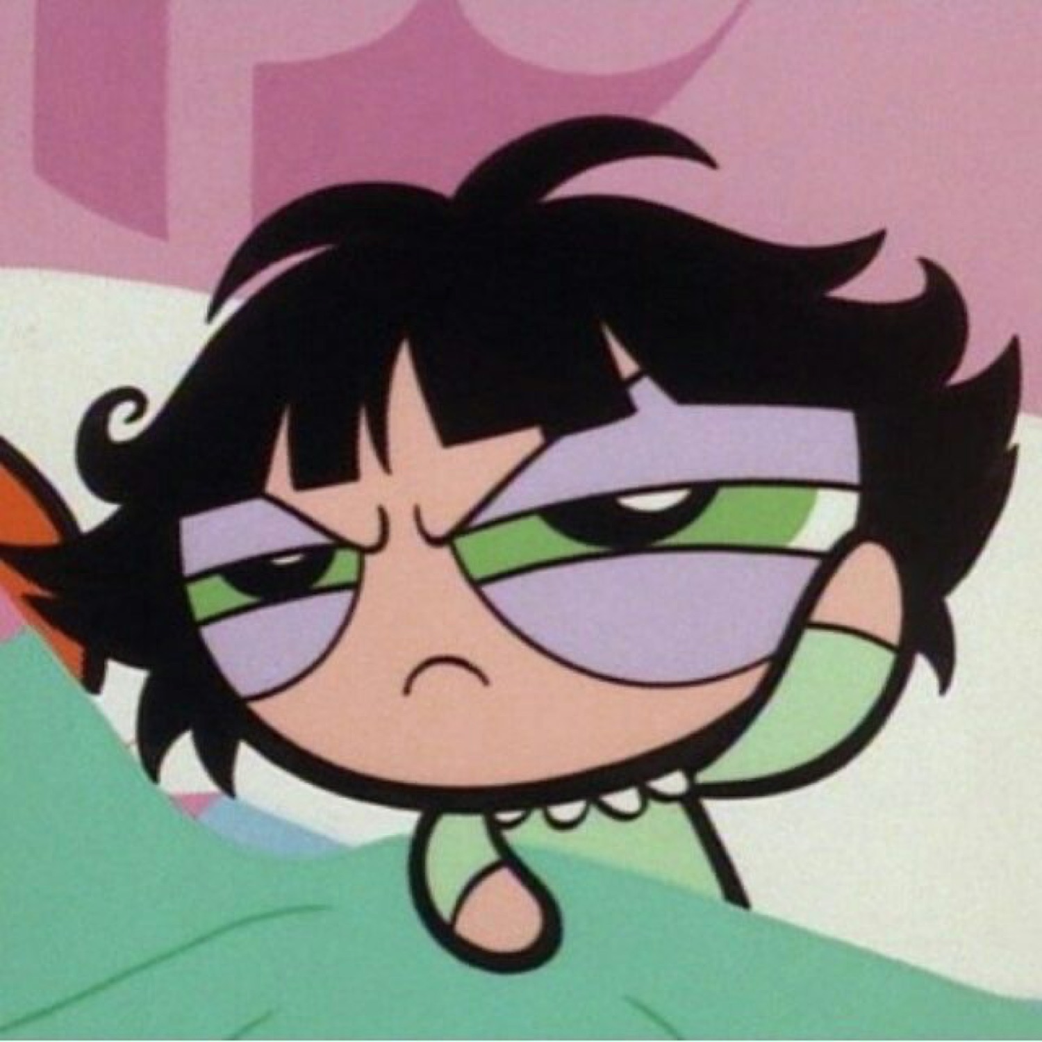 Buttercup from the Powerpuff Girls glaring grumpily from bed