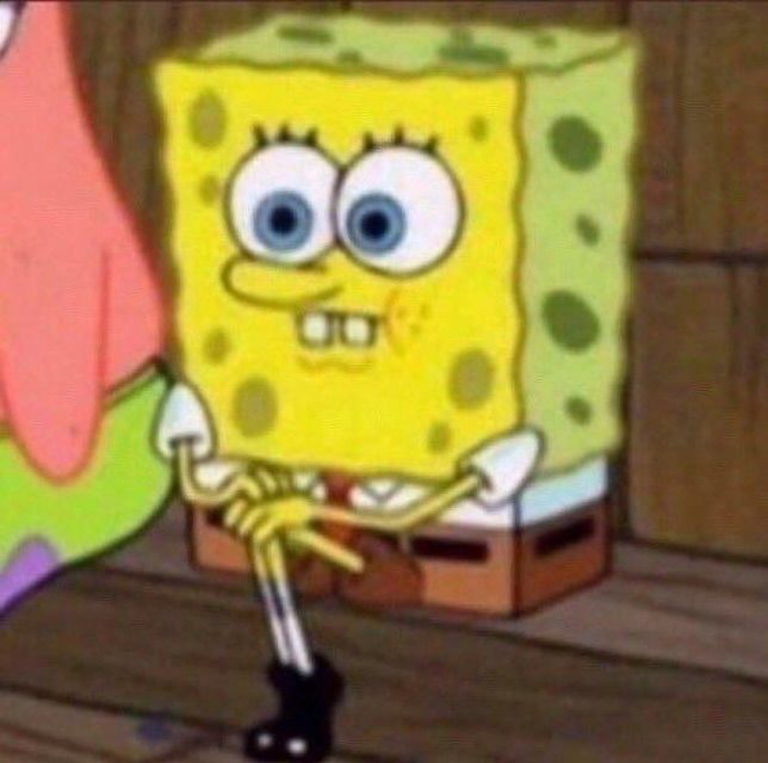 SpongeBob wringing his hands with a tense, nervous grimace next to Patrick