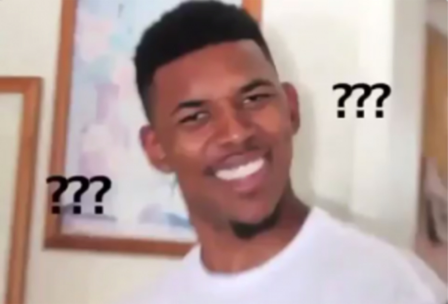 Guy smiling with question marks floating around him like he's genuinely confused but fine with it