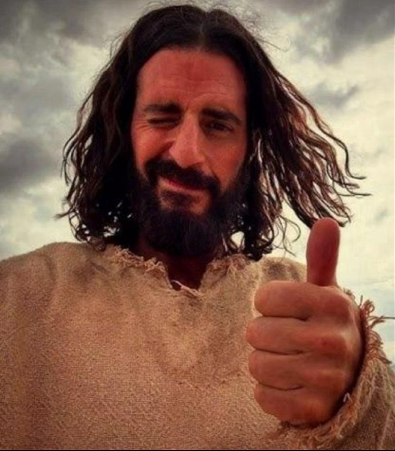 Jesus winking and giving a thumbs up