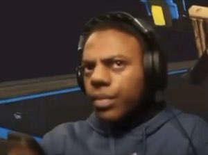 Guy in gaming headphones frowning at his screen, thoroughly confused
