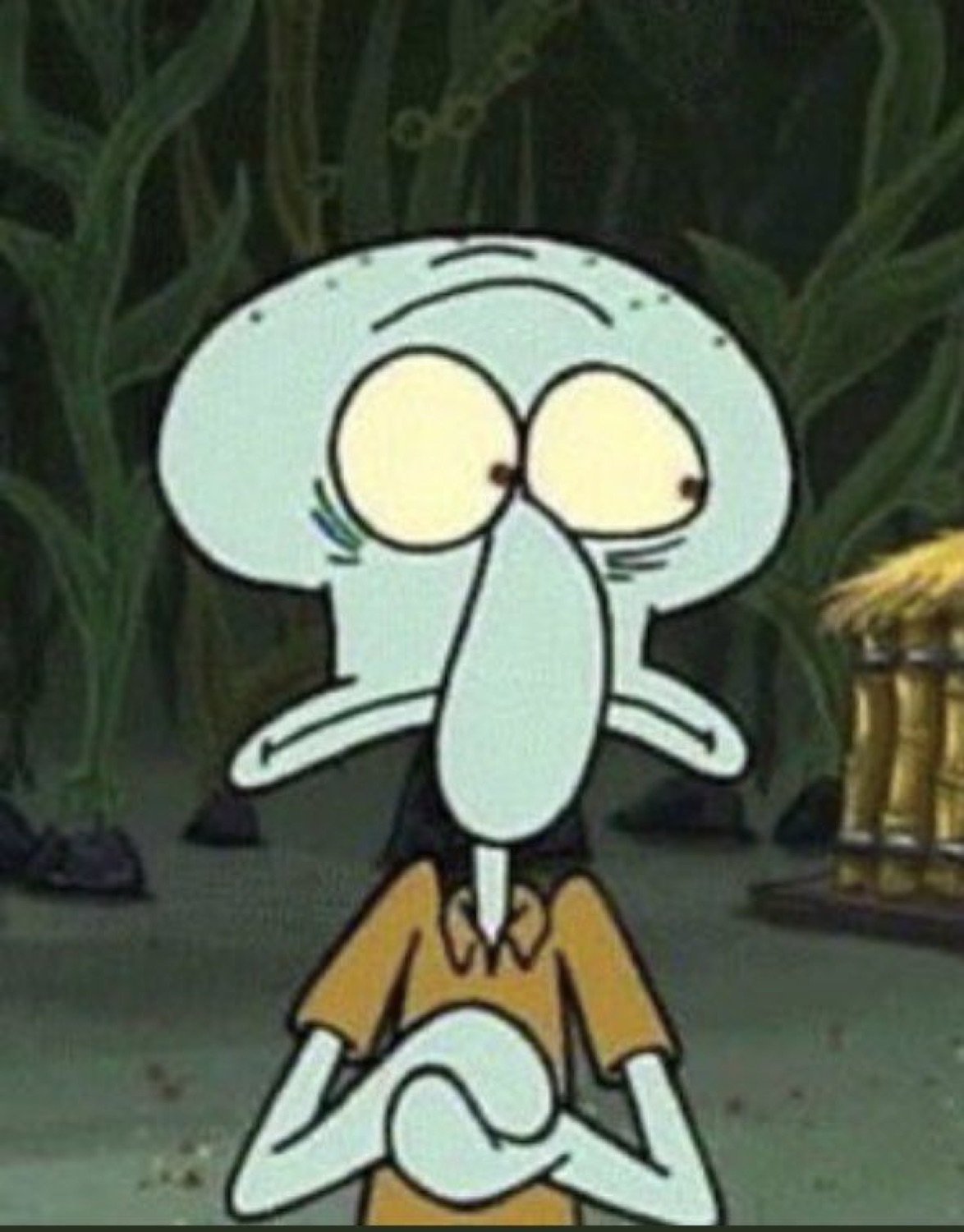 Squidward wide-eyed and twitchy, clasping his hands nervously in a dark seabed setting