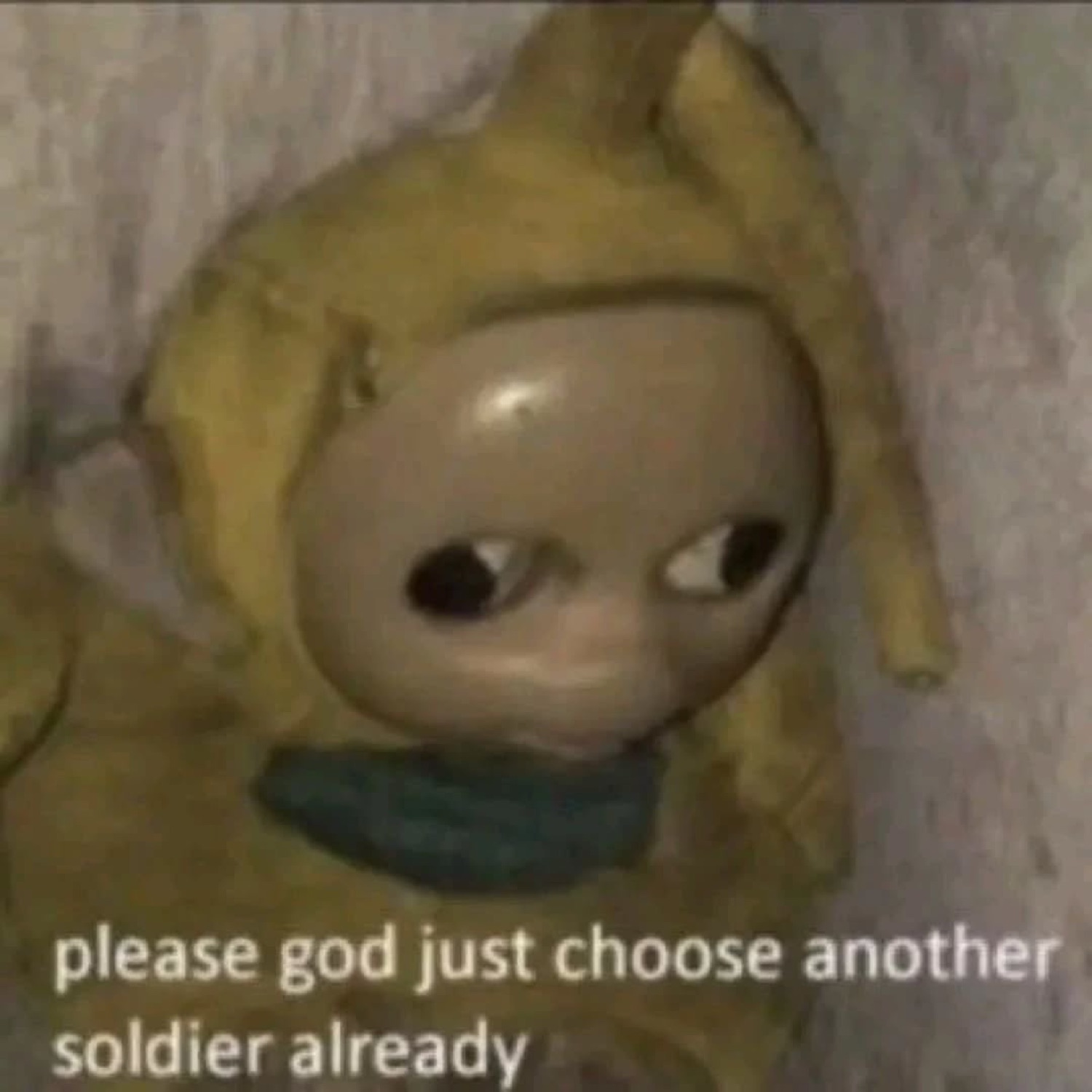 Creepy cross-eyed Teletubby doll captioned 'please god just choose another soldier already'