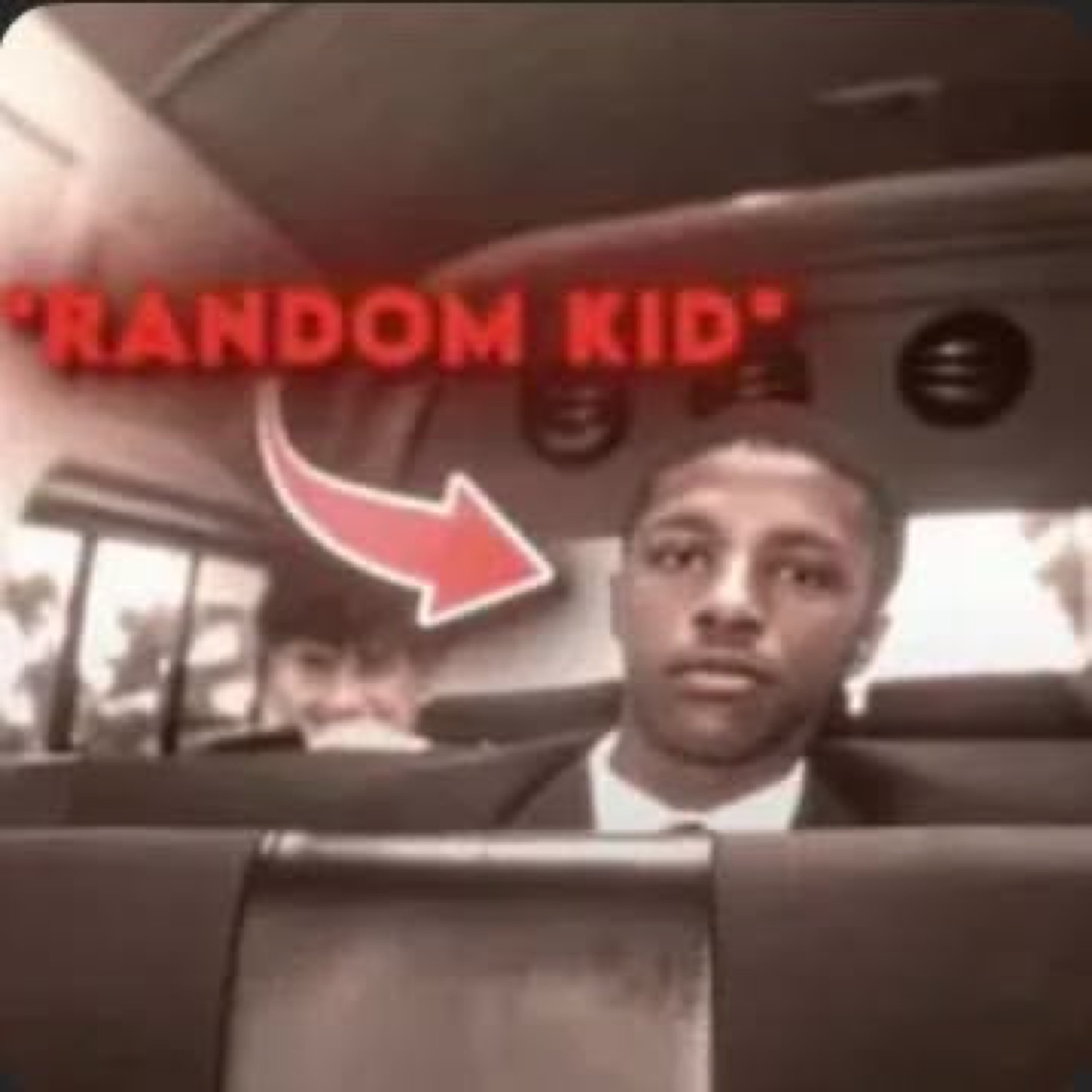 Young man on a bus staring blankly, labeled '*RANDOM KID*' with a red arrow