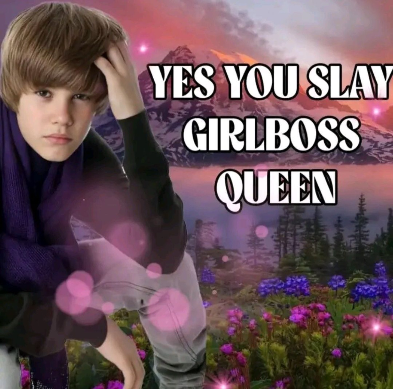 Young Justin Bieber posing over a flowery mountain scene with 'YES YOU SLAY GIRLBOSS QUEEN' text