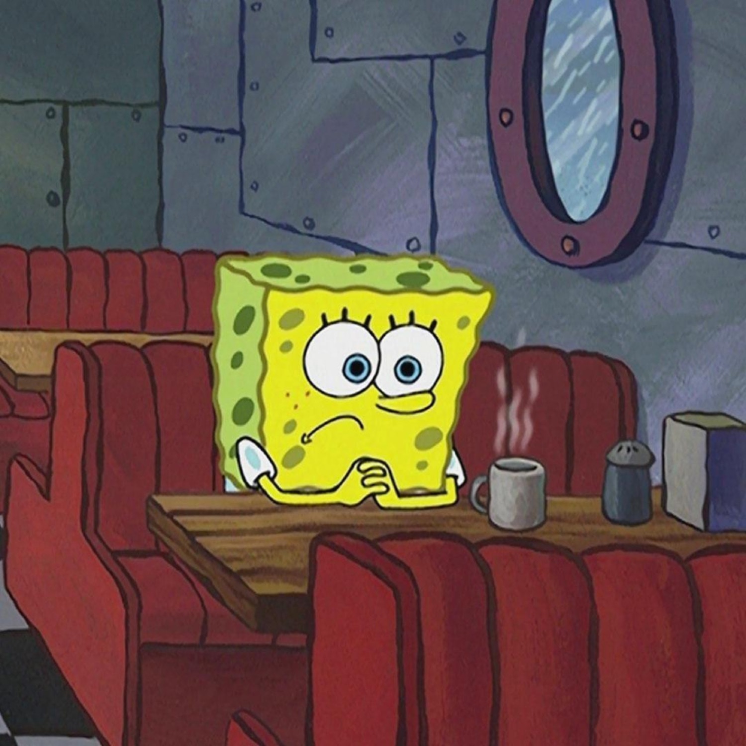 SpongeBob sitting alone at a diner booth resting his chin, looking glum and bored