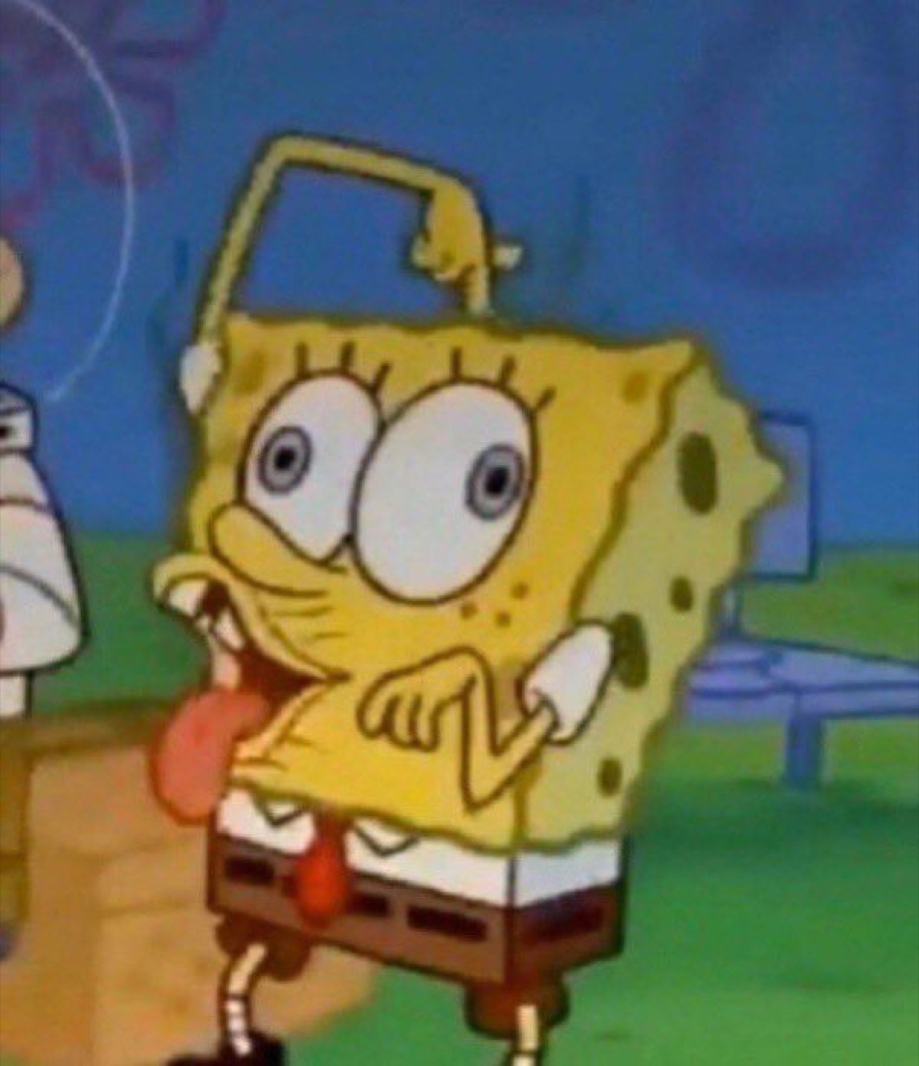 SpongeBob wide-eyed and hugging himself with tongue out in giddy excitement