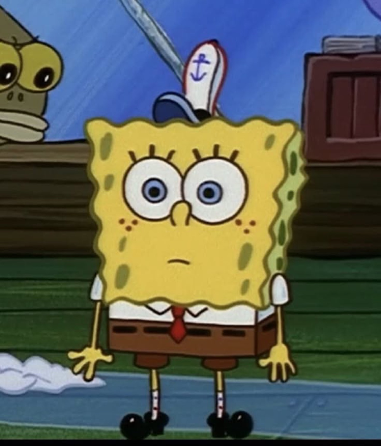 SpongeBob standing stiffly with a blank, faintly worried stare