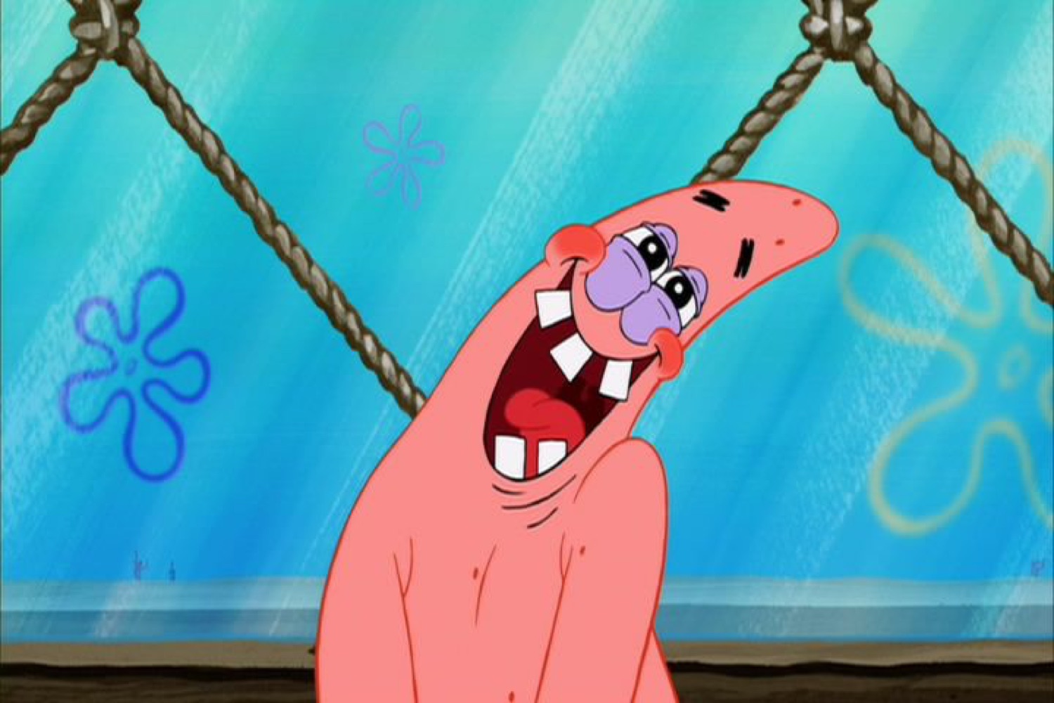 Patrick Star from SpongeBob laughing hysterically with bruised eyes
