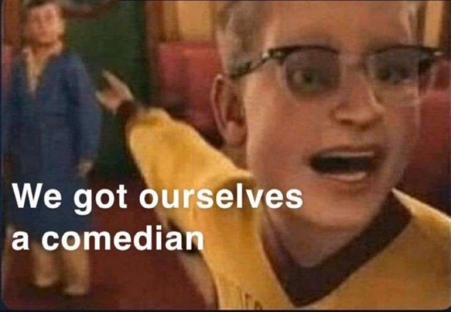 Kid in big glasses pointing and shouting 'We got ourselves a comedian'