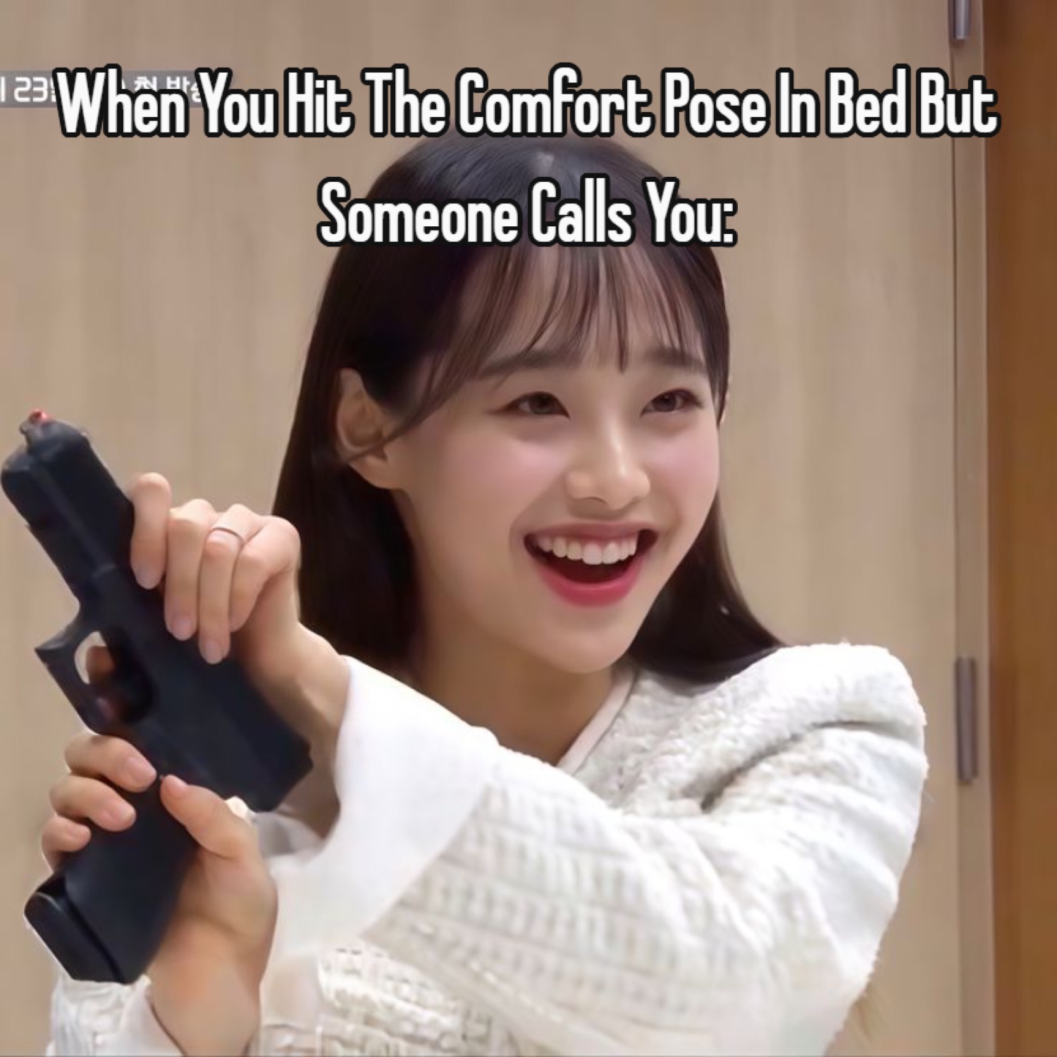 Young woman laughing and wielding a handgun, captioned 'When You Hit The Comfort Pose In Bed But Someone Calls You:'