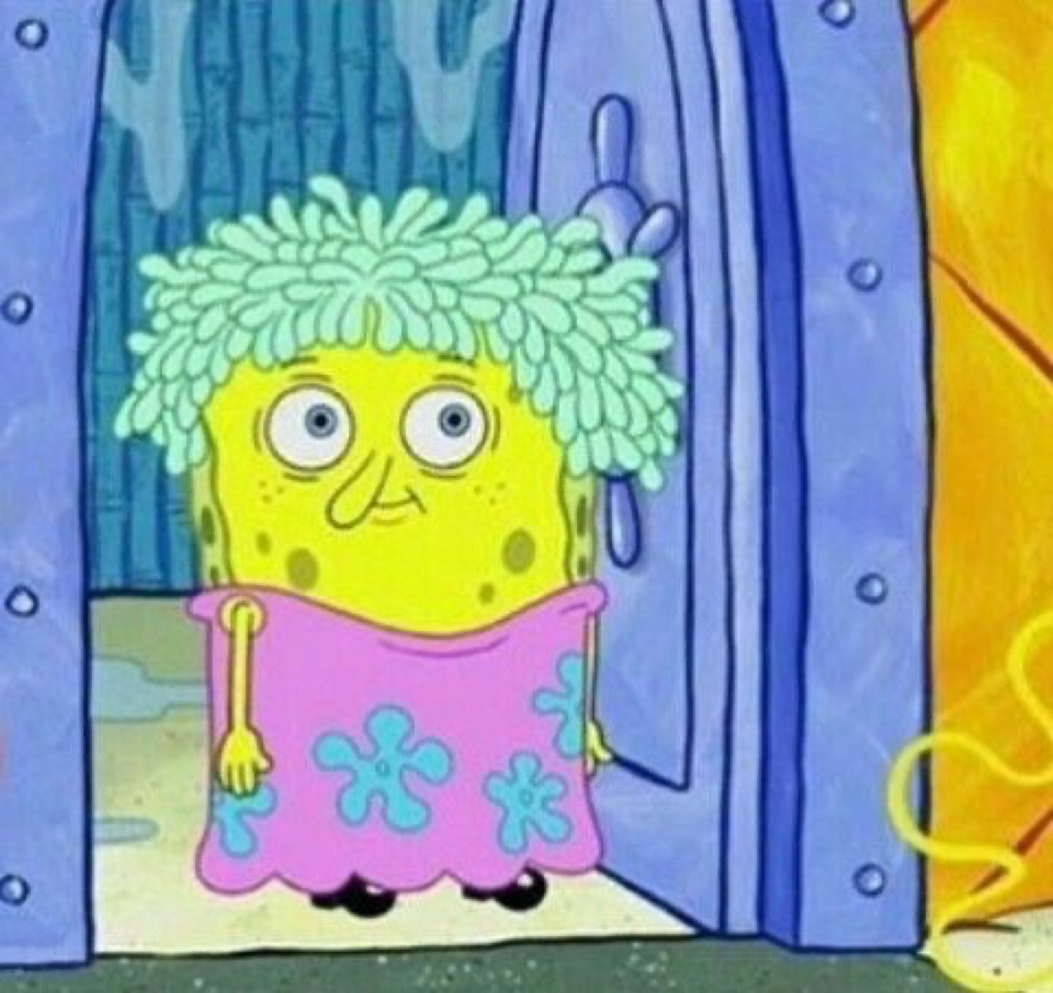 SpongeBob in a mop wig and pink dress standing in the doorway looking rough