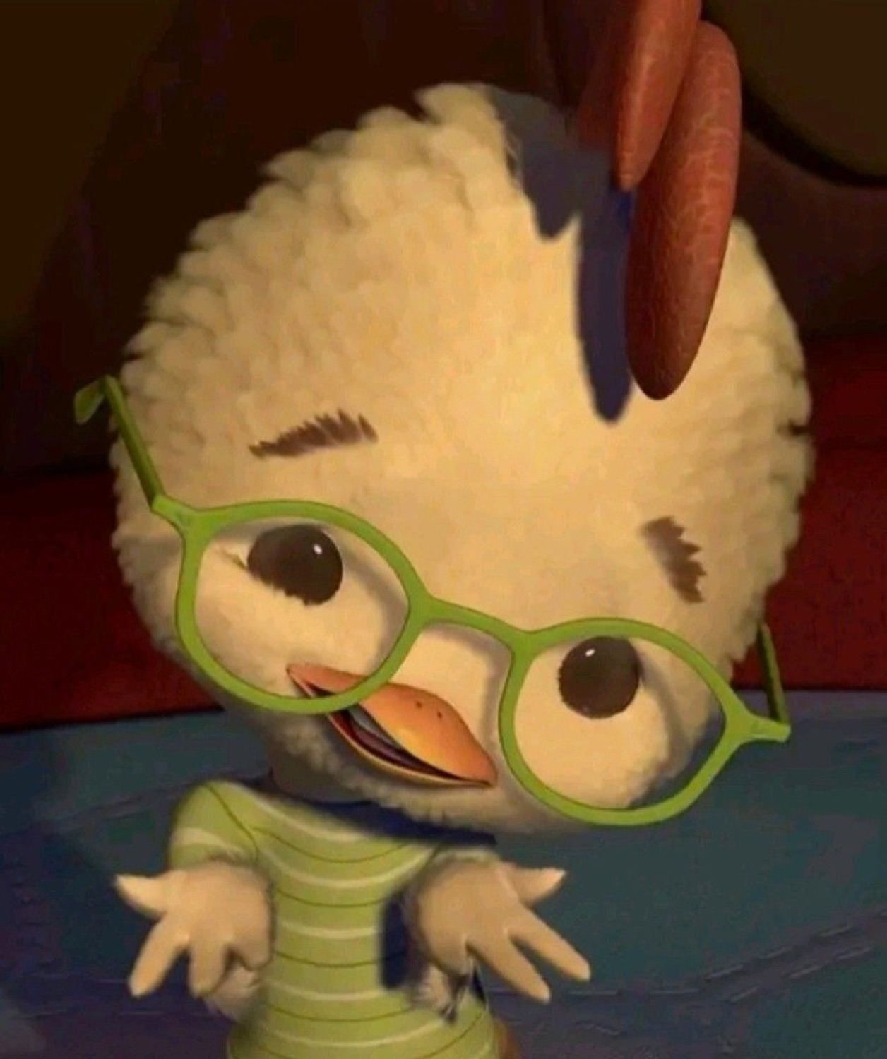 Chicken Little in green glasses shrugging with a nervous little grin