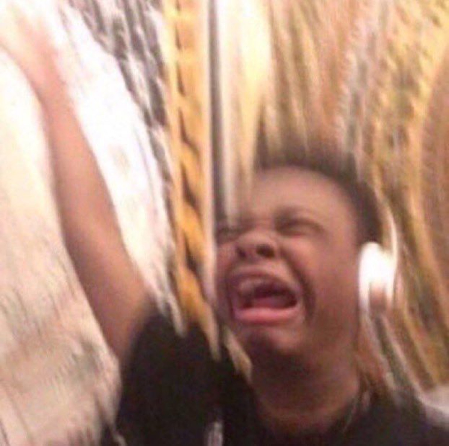 Kid on a swing sobbing and screaming their whole heart out mid-air