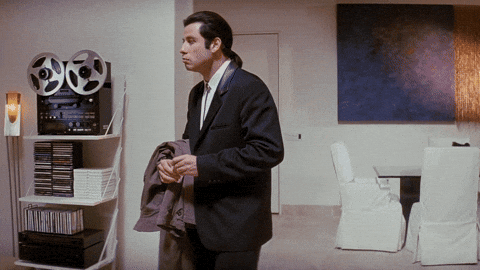 John Travolta in Pulp Fiction looking around confused in an empty room