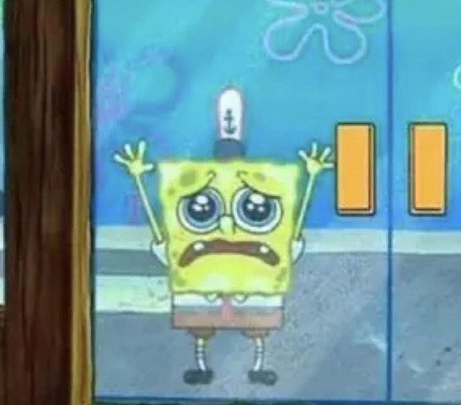 SpongeBob outside a glass door with teary eyes and hands up, close to sobbing