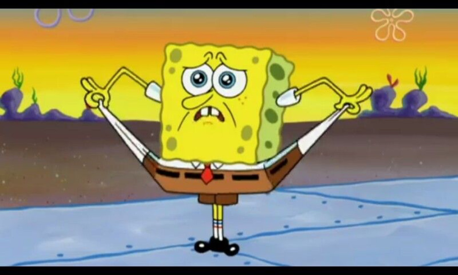 SpongeBob standing with arms out and a strained, worried grimace