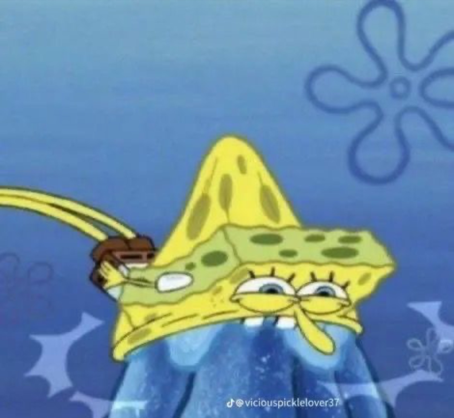 SpongeBob face-mashed into a blue surface looking utterly exhausted and defeated