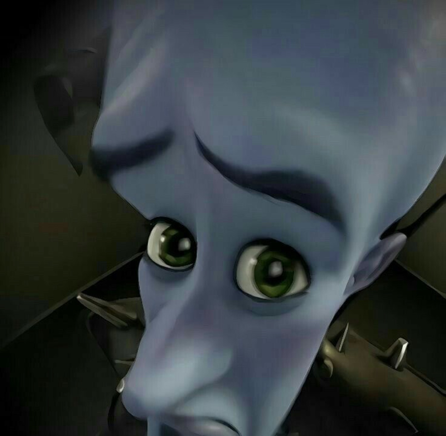 Megamind staring up with wide, worried eyes from a very low angle