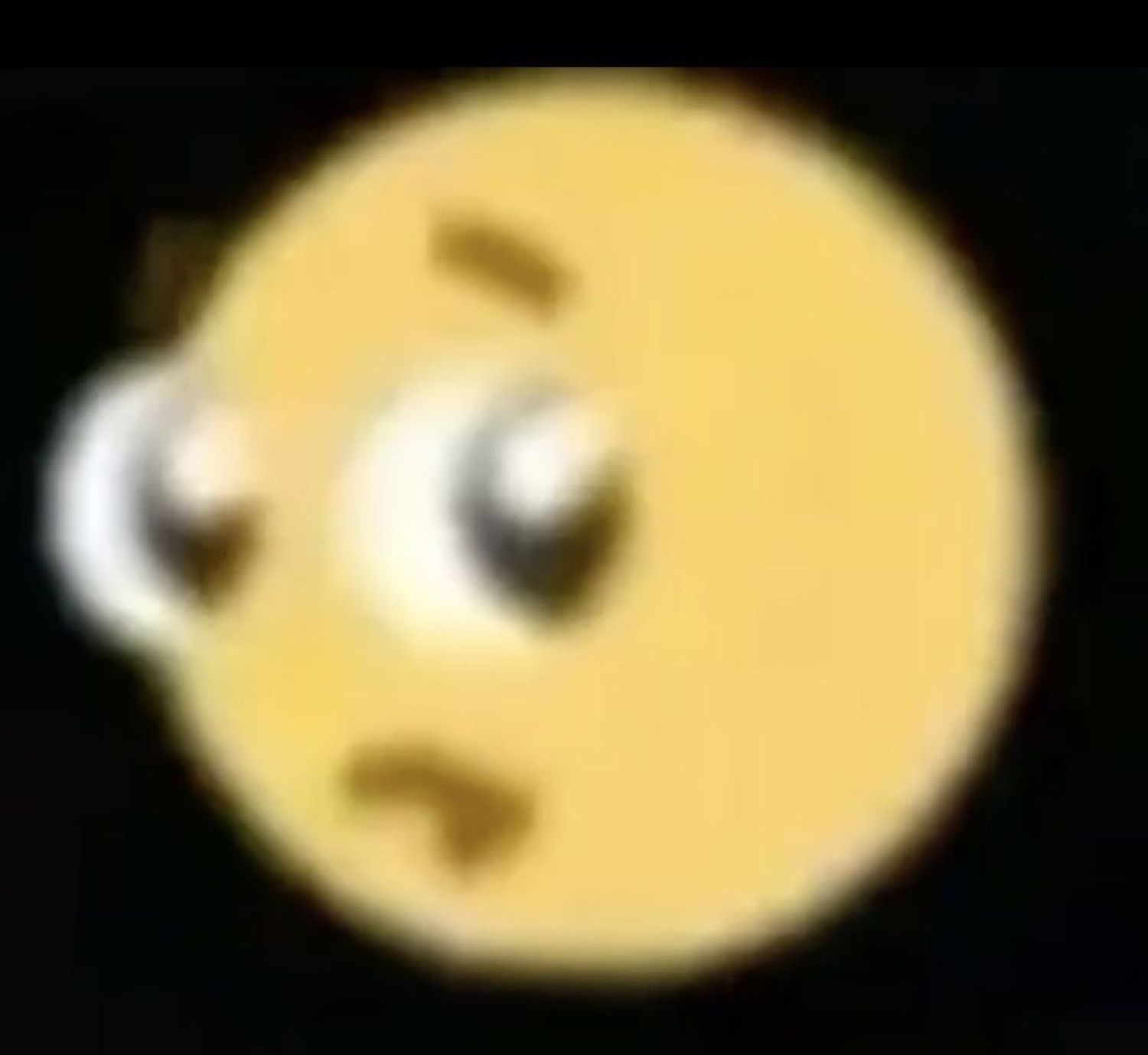 Blurry yellow emoji with woozy uneven eyes staring off into space